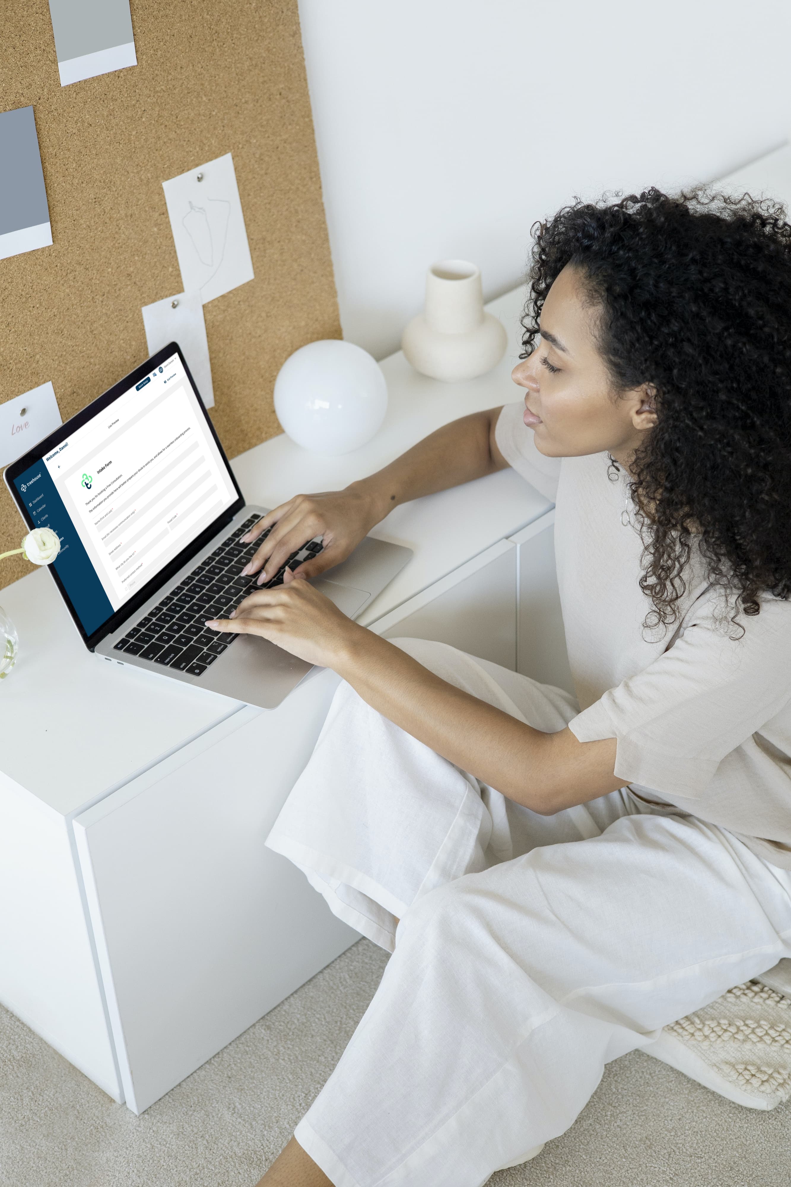 Woman using the Treehouse Essentials eforms feature on her laptop